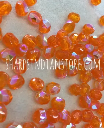 6MM GLASS FACETED 531 PALE ORANGE AB