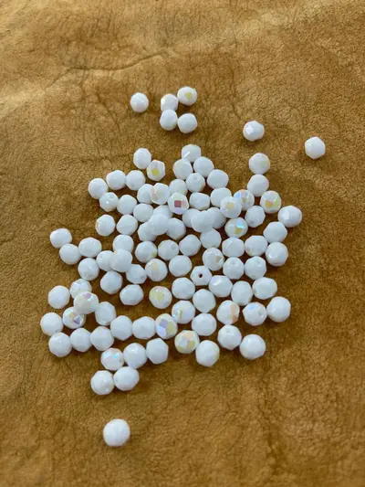 6MM GLASS FACETED 511 OPAQUE WHITE AB