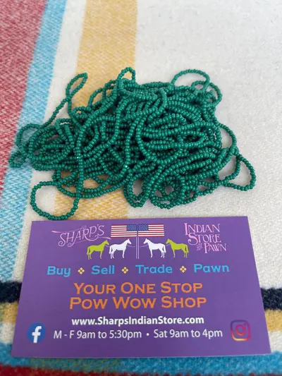 11/0 CUT BEAD 186-T/C OPAQUE DARK GREEN