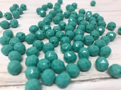 8MM GLASS FACETED 185 OPAQUE TURQUOISE GREEN