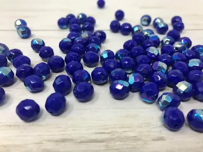8MM GLASS FACETED OPAQUE BLUE AB