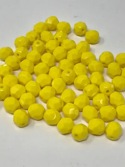 6MM GLASS FACETED 122 LT. YELLOW