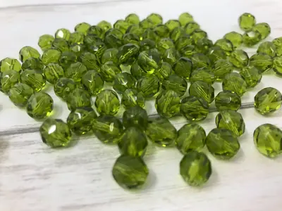 8MM 281 GLASS FACETED TRANSPARENT OLIVE