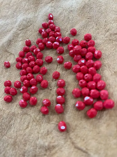6MM GLASS FACETED #142 OPAQUE LIGHT RED