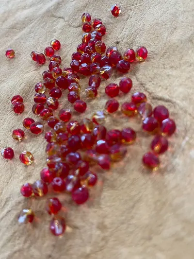 6MM GLASS FACETED #5254 CRYSTAL RUBY LIGHT AMBER
