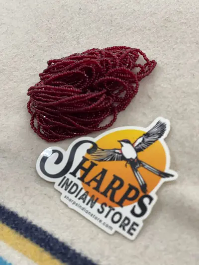 11/0 CUT BEAD #246 TRANS GARNET