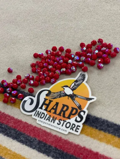 6MM GLASS FACETED OPAQUE RED AB