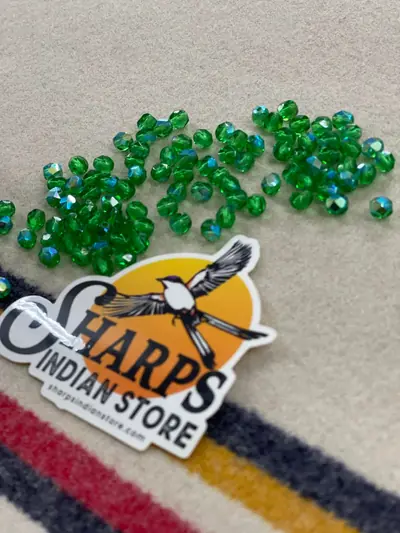 6MM GLASS FACETED TRANSPARENT EMERALD AB