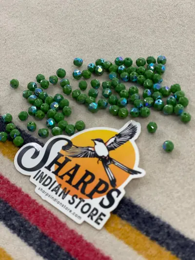 6MM GLASS FACETED OPAQUE GREEN AB